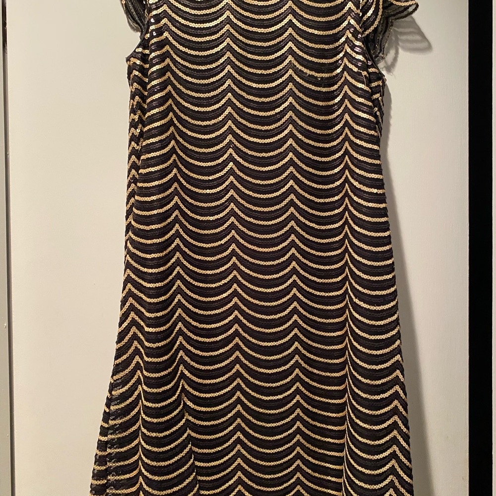 Vintage party dress black and gold sequences in scalloped design on net.